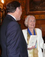 Edie with the governor and her shiny new medal!